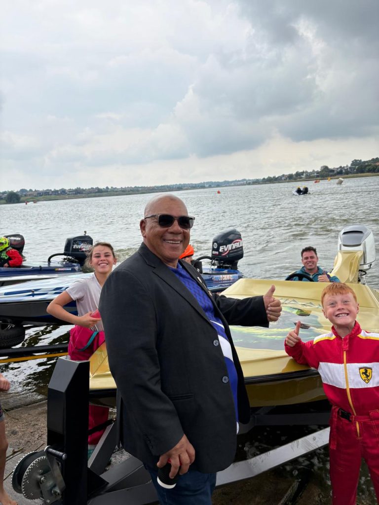 A powerboat crew giving the thumbs up on the water at Rynfield